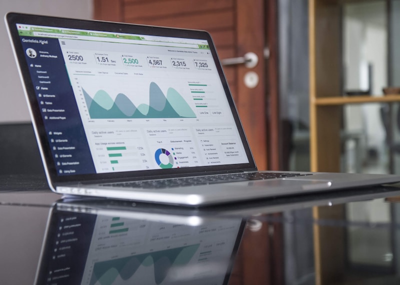 Business owner analyzing financial charts and ROI data from AI tool investments