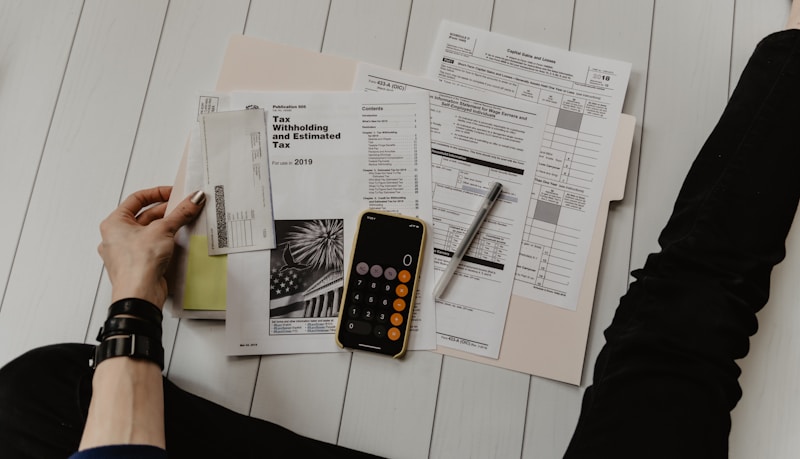 Business owner reviewing AI small business budget spreadsheet with positive ROI results